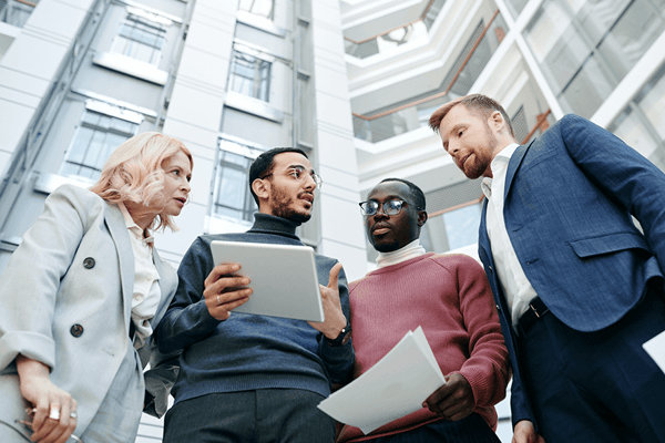 Business People Discussing with a Tablet