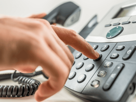 Person dialing work phone