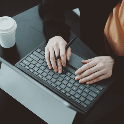 Person typing on laptop