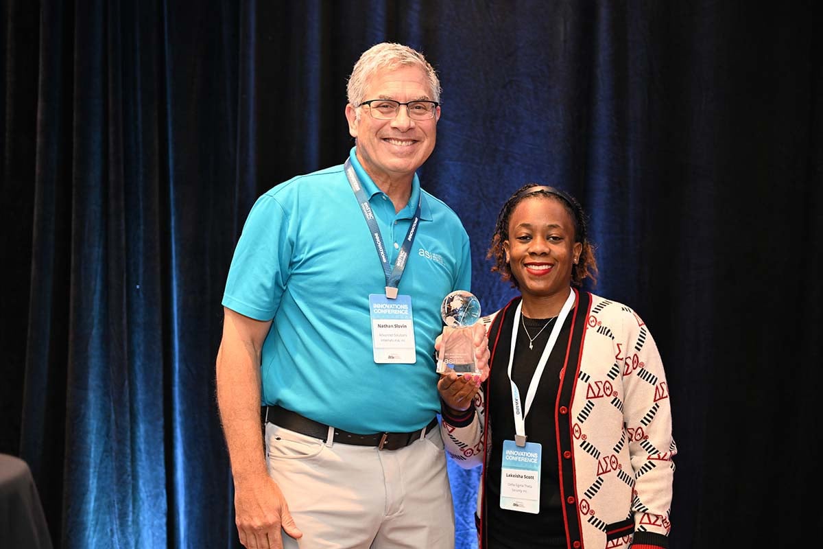A Great Things Award Winner accepts a trophy