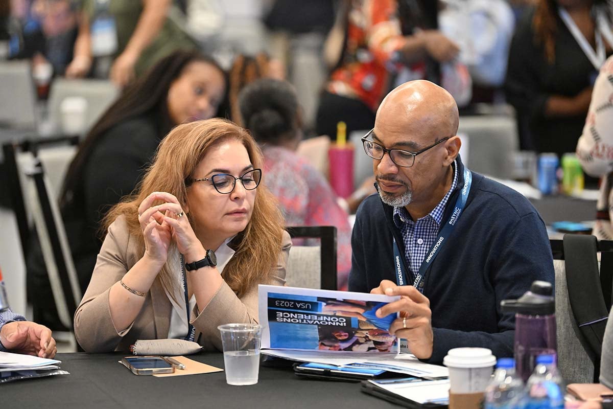 iNNOVATIONS attendees chat at the conference