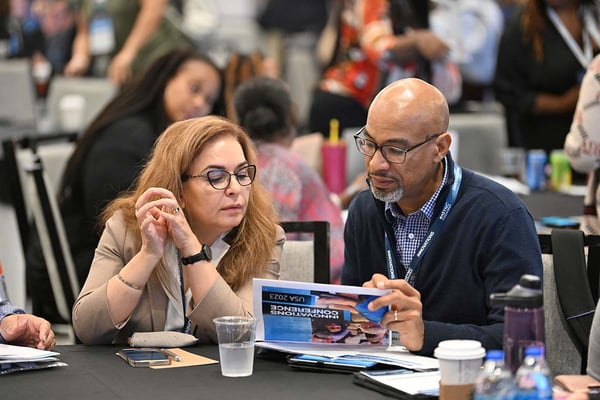 iNNOVATIONS attendees chat at the conference